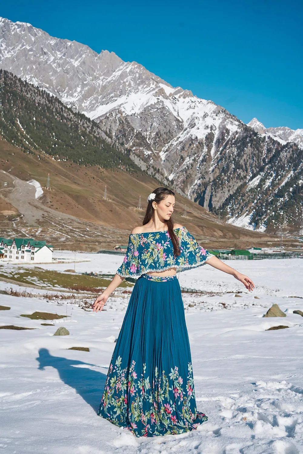 navy blue floral hand emdroiderd off sholulder cape blouse with pleated lehanga made in georgette fabric